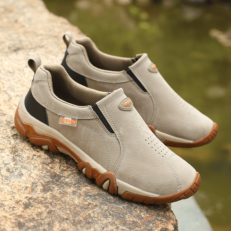 Non-slip outdoor hiking shoes for men with rubber outsole and stretch fabric, on rocky surface, light trekking shoes SF1156